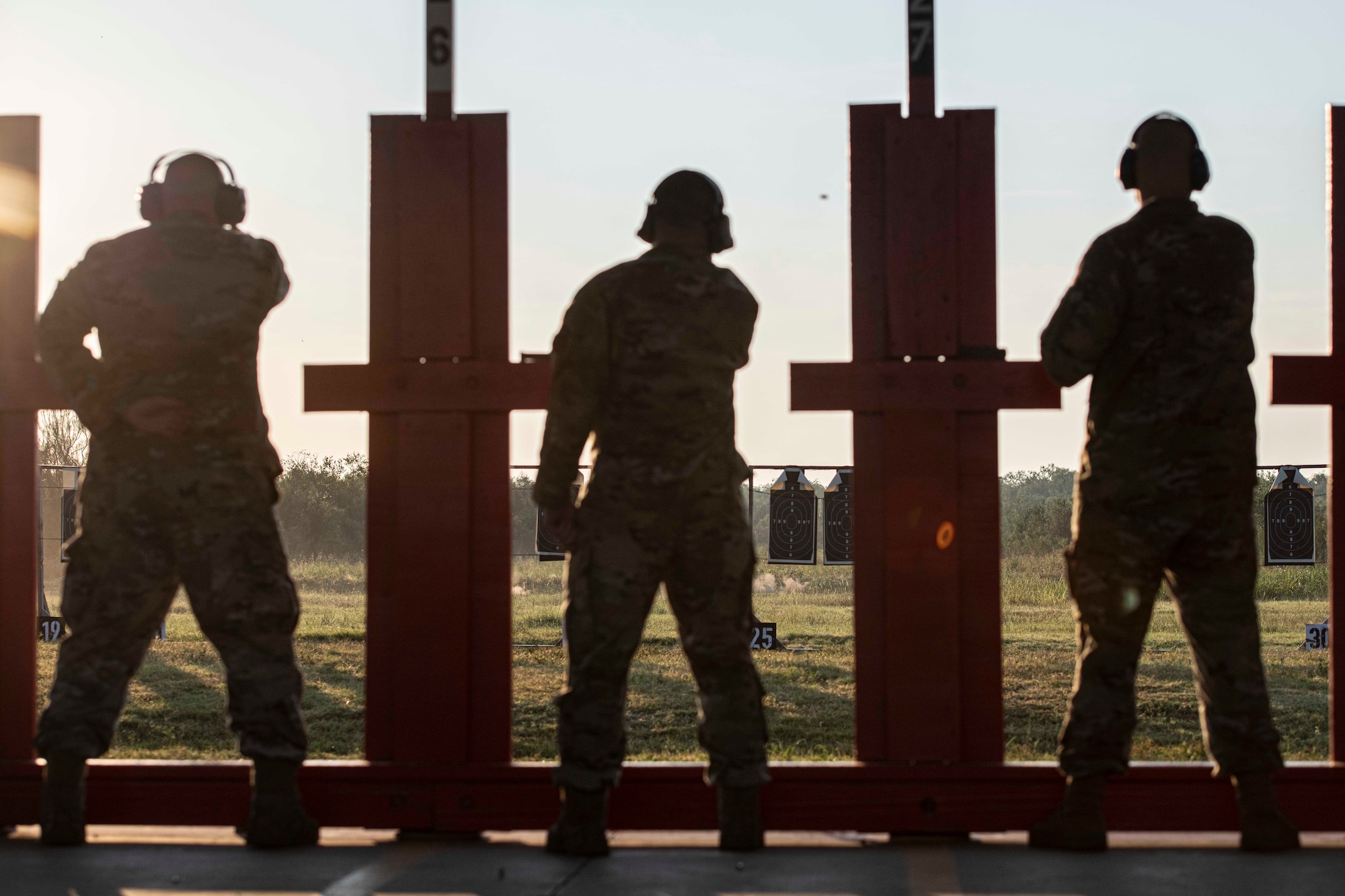 Silhouettes of 3 shooters