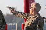 Female NCO fires weapon