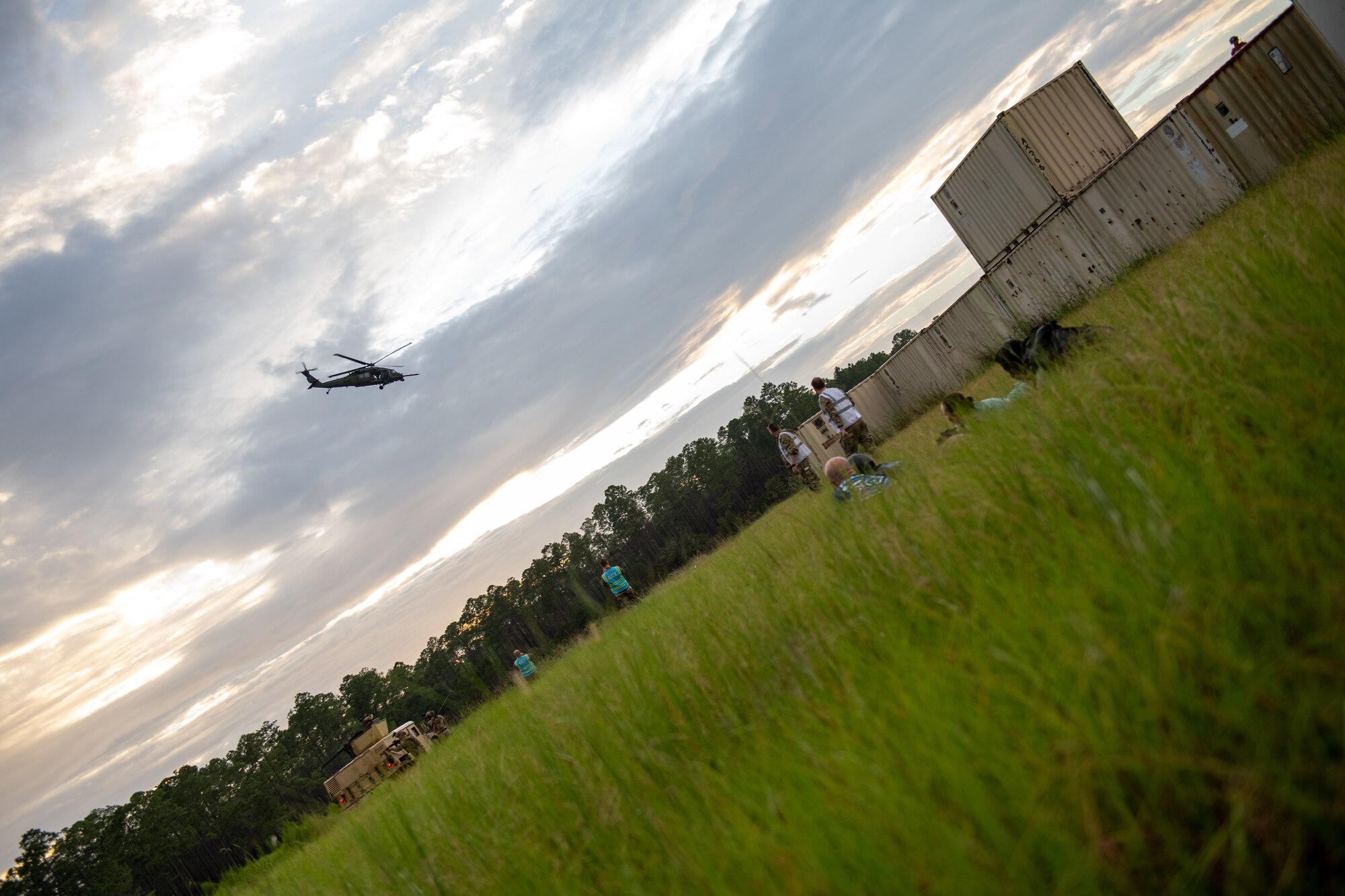 Photo of helicopter flying over a field