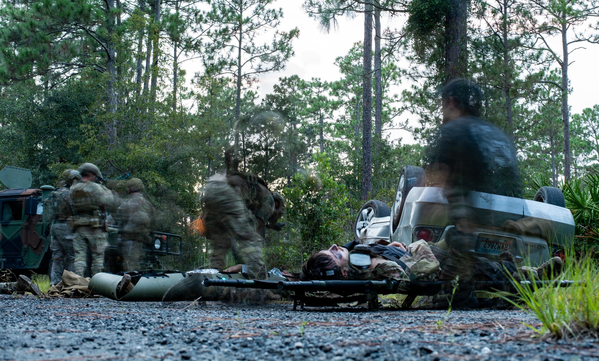 Photo of Airmen conducting medical training in the woods