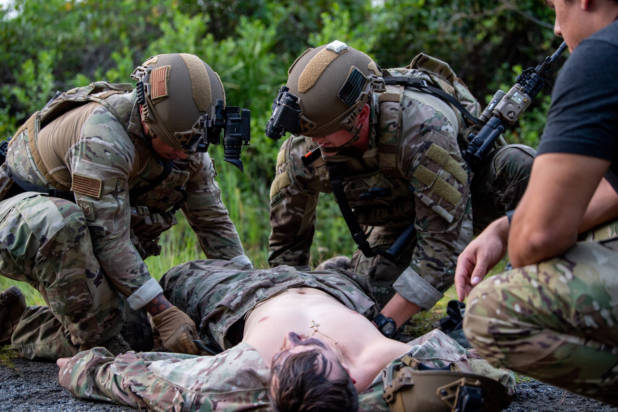 Photo of Airmen conducting medical training on another Airman laying on the ground