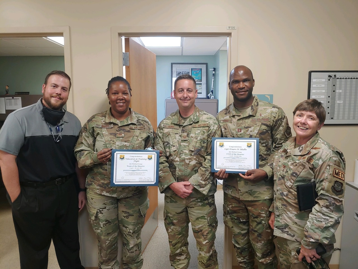 Personnel assigned to the 6th Medical Group’s Education and Training Flight, MacDill Air Force Base, Florida, pose for a group photo Aug. 3, 2021. The Education and Training Flight was presented the 6th MDG’s ‘Team of the Quarter’ for April 1 – June 30, 2021. The team pioneered a Department of Defense transition from self-aid buddy care to tactical combat casualty care and certified 12 instructors across the command. From left, Dustin Sieff, Tech Sgt. Kierra Baker, Master Sgt. Matthew Hunn, Capt. Oruaro Idudhe and Col. Cheryl Lockhart (Not pictured: James Norbech and Richard Cook). (Courtesy photo)
