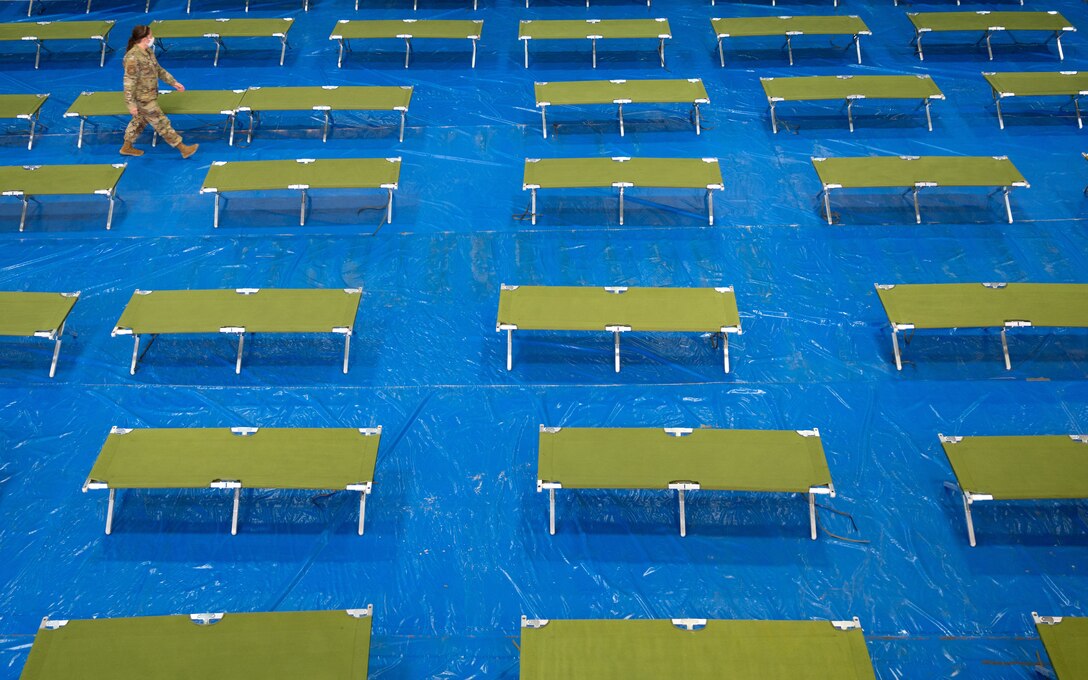 Tech. Sgt. Whitney O’Neill, 49th Force Support Squadron Fitness Center noncommissioned officer in charge, counts cots for Task Force-Holloman personnel Aug. 27, 2021 on Holloman Air Force Base, New Mexico. The Department of Defense, through U.S. Northern Command, and in support of the Department of Homeland Security, is providing transportation, temporary housing, medical screening, and general support for up to 50,000 Afghan evacuees at suitable facilities, in permanent or temporary structures, as quickly as possible. This initiative provides Afghan personnel essential support at secure locations outside Afghanistan. (U.S. Air Force photo by Tech. Sgt. BreeAnn Sachs)