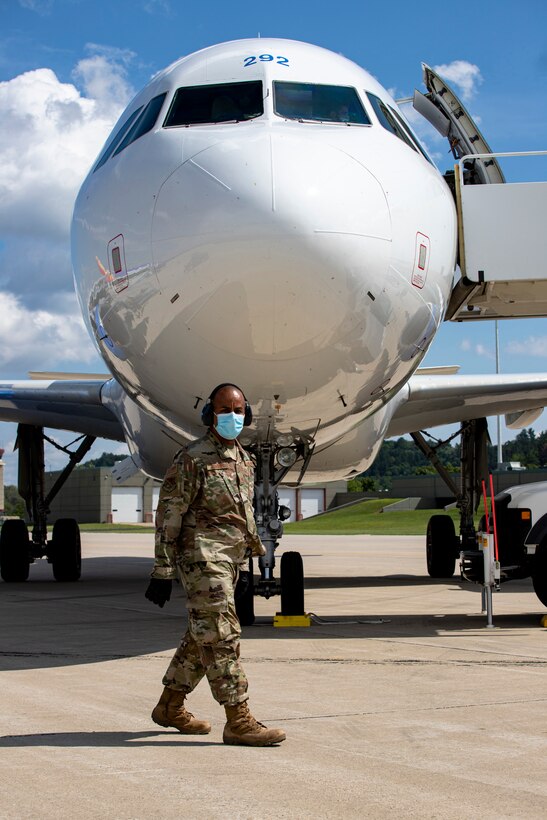 An Airman from the Kentucky Air National Guard's 123rd Contingency Response Group receives a plane of Afghan evacuees at Volk Field, Wis., Aug. 29, 2021. The Department of Defense, in support of the Department of Homeland Security and the Department of State, is providing transportation and temporary housing for evacuees as part of Operation Allies Refuge. The initiative follows through on America’s commitment to Afghan personnel who have helped the United States, and provides them essential support at secure locations outside Afghanistan. (U.S. Army photo by Spc. Rhianna Ballenger, 55th Signal Company)