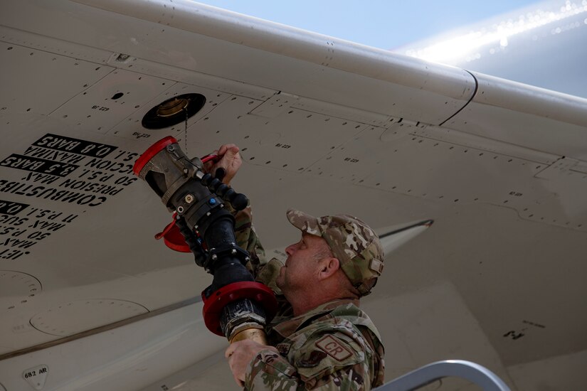An Airman from the Kentucky Air National Guard's 123rd Contingency Response Group refuels a plane after it brought Afghan evacuees to Volk Field, Wis., Aug. 29, 2021. The Department of Defense, in support of the Department of Homeland Security and the Department of State, is providing transportation and temporary housing for evacuees as part of Operation Allies Refuge. The initiative follows through on America’s commitment to Afghan personnel who have helped the United States, and provides them essential support at secure locations outside Afghanistan. (U.S. Army photo by Spc. Rhianna Ballenger, 55th Signal Company)