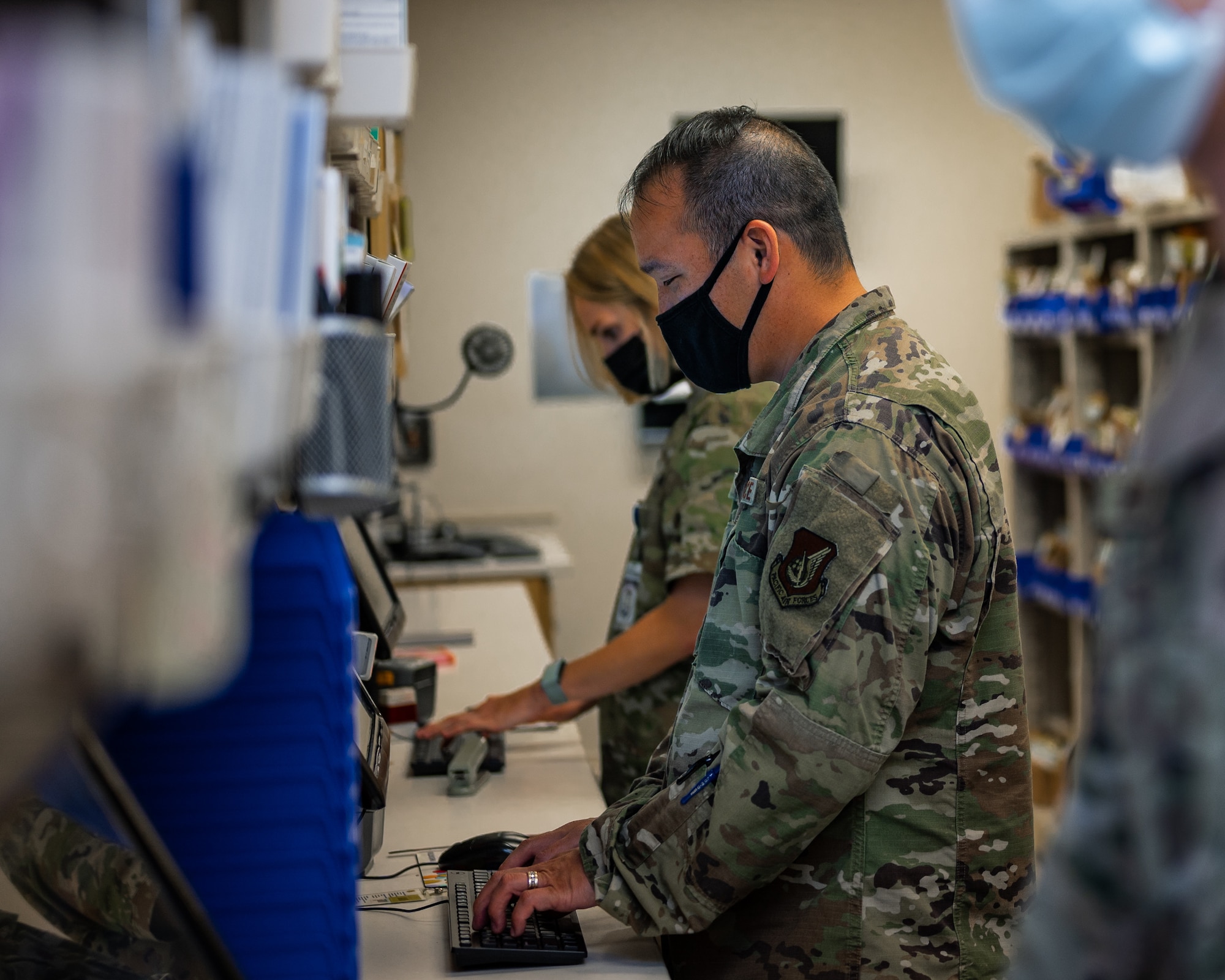 U.S. Air Force Maj. John Wu, 18th Medical Support Squadron pharmacy flight commander, checks prescriptions at Kadena Air Base, Japan, Sept. 1, 2021. The 18th MDSS trains and supports medical group unit type codes and war reserve material projects. (U.S. Air Force photo by Airman 1st Class Stephen Pulter)