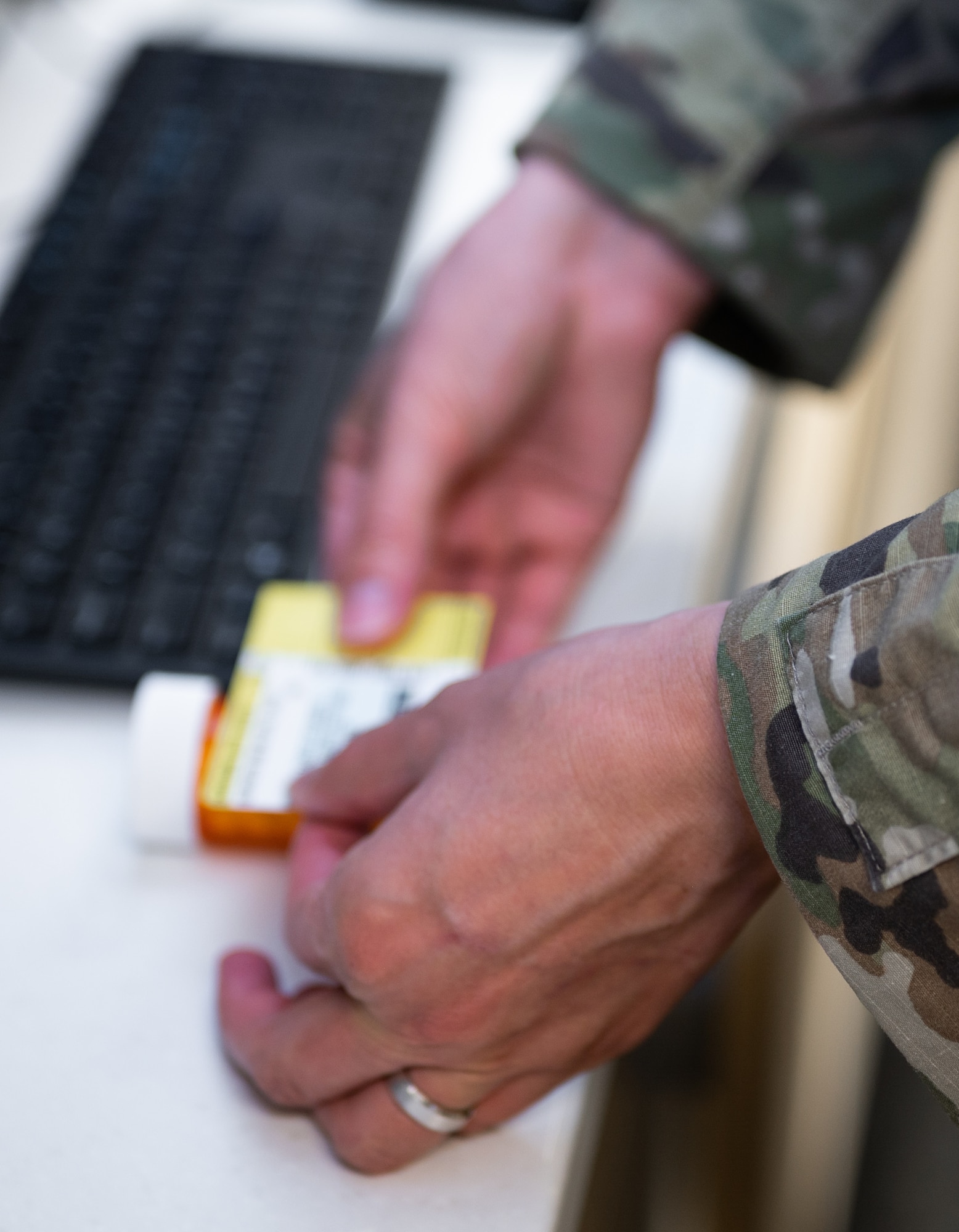 U.S. Air Force Tech. Sgt. Andrew Bañales, 18th Medical Support Squadron NCO in charge of pharmacy, applies a label to a pill bottle at Kadena Air Base, Japan, Sept. 1, 2021. There are over 20 medical career fields in the Air Force ranging from administration to surgical care. (U.S. Air Force photo by Airman 1st Class Stephen Pulter)