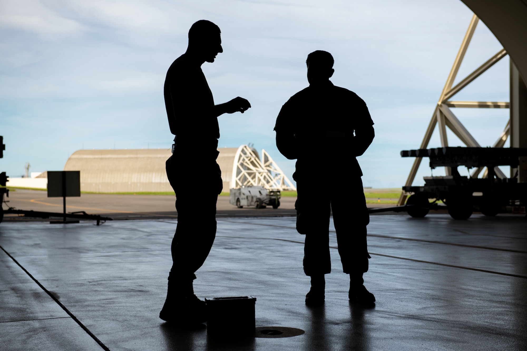 U.S. Air Force Airmen from the 44th Aircraft Maintenance Unit discuss training procedures.