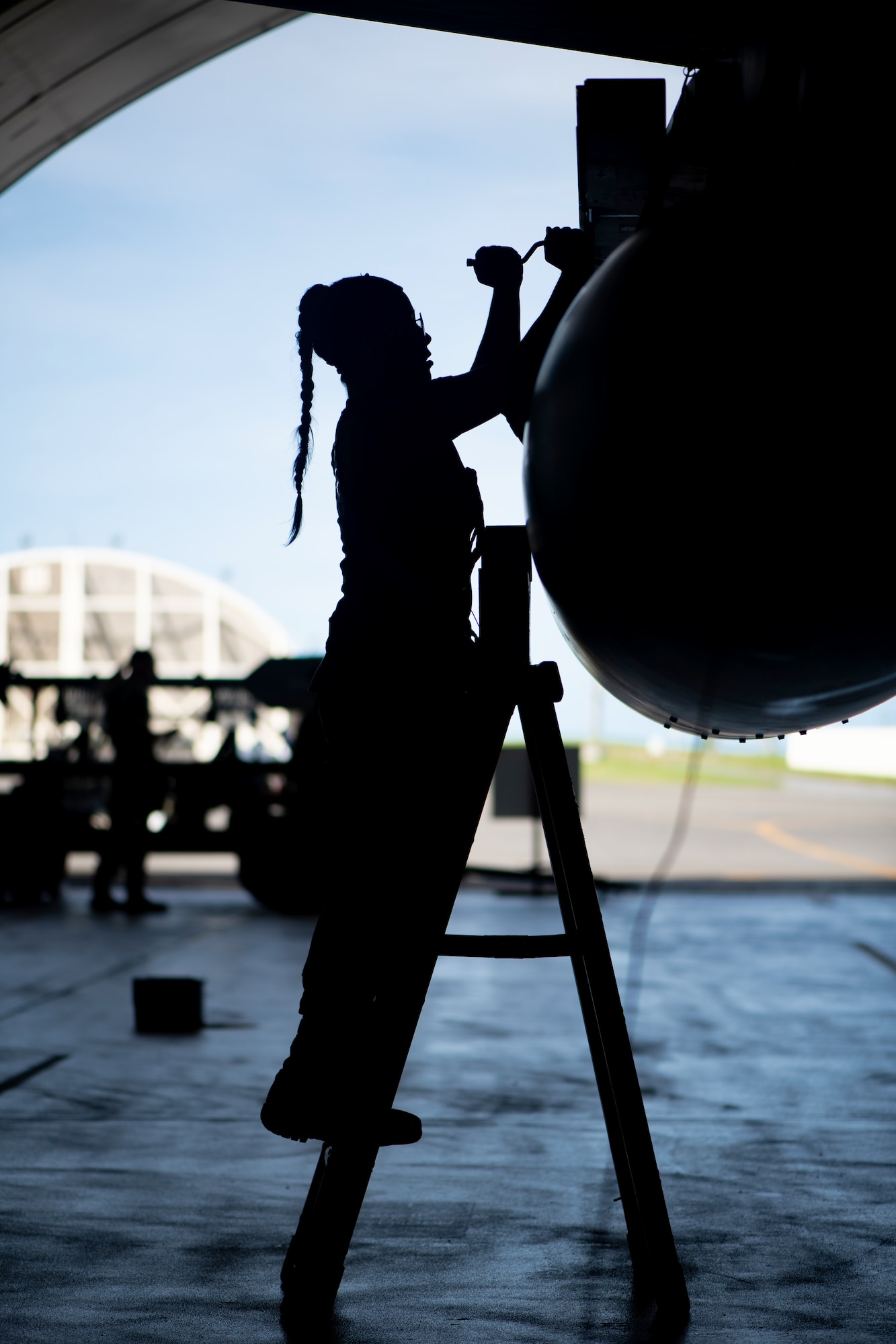 U.S. Air Force Airman 1st Class Sara Maxwell, 44th Aircraft Maintenance Unit weapons load crew member, works on an F-15C Eagle during training.