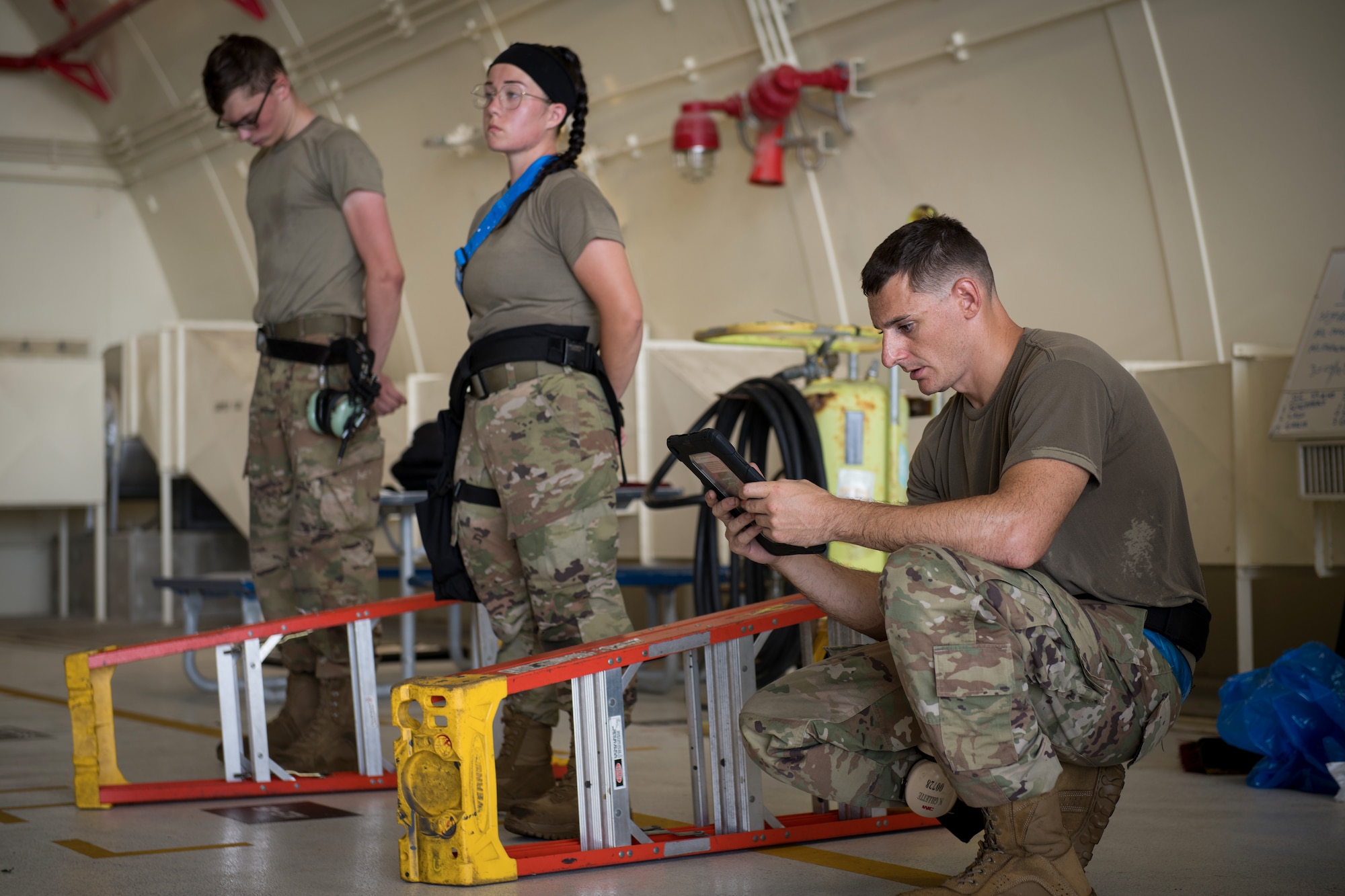 U.S. Air Force Airmen from the 44th Aircraft Maintenance Unit wait for their evaluation to be finalized