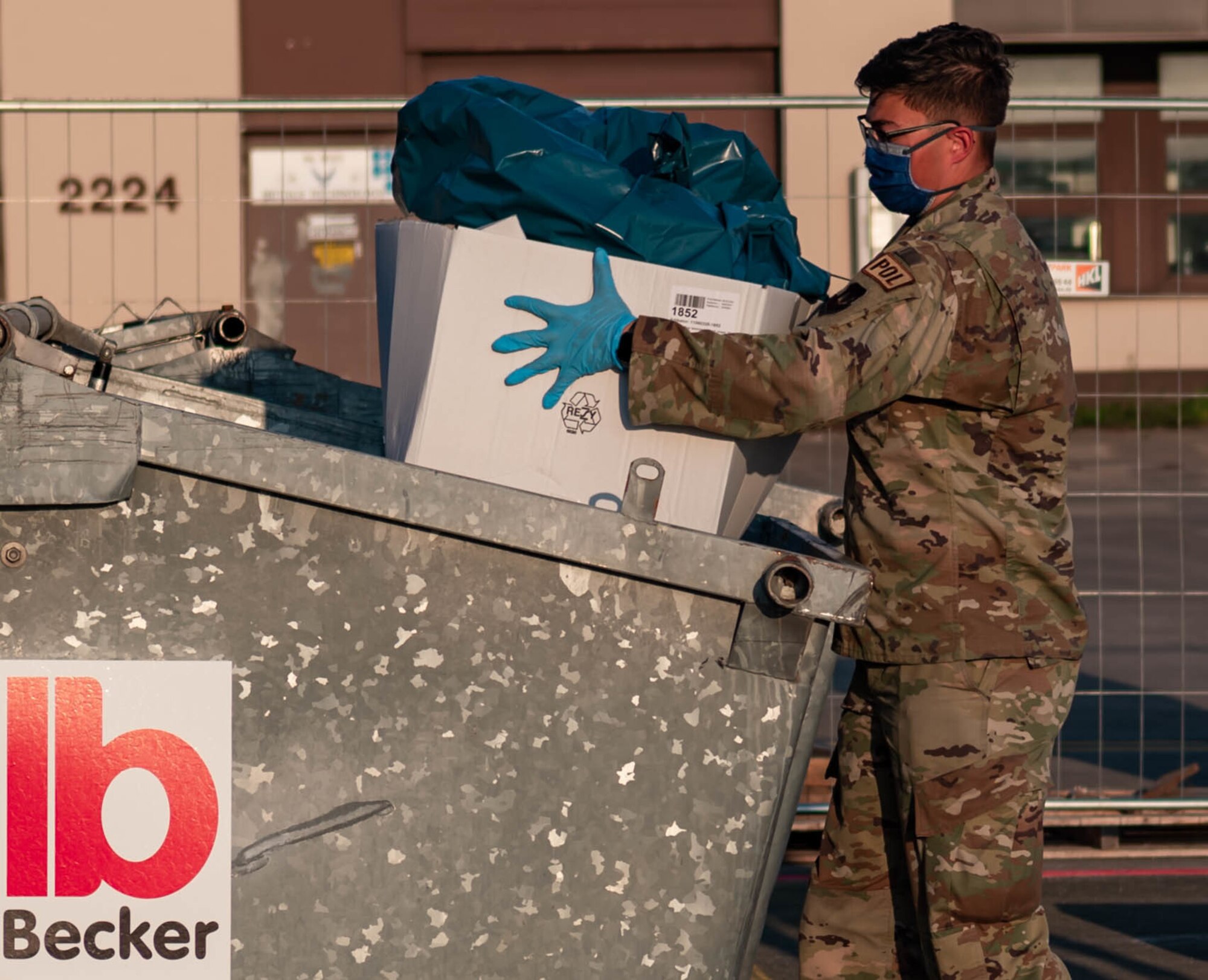 Airman throws away trash.