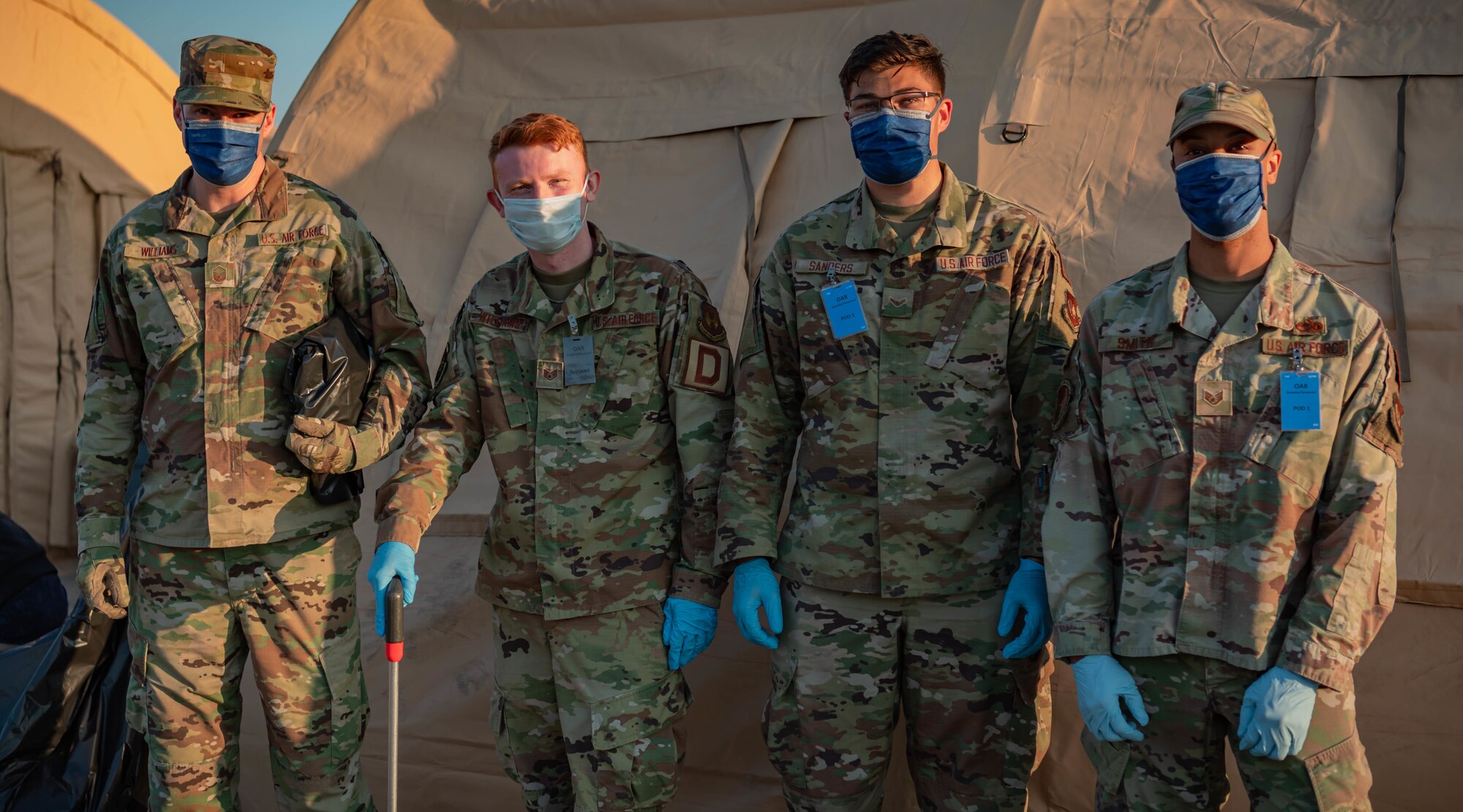 Airmen pose for photo.