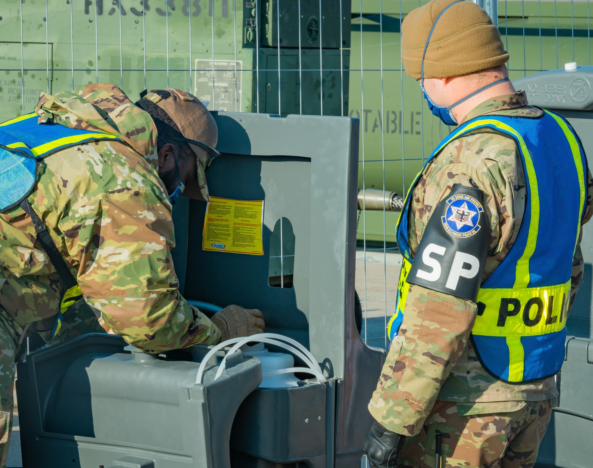 Airman provide maintenance to a washing station.