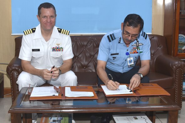 210730-F- F3963-1001
Indian Air Force Air Vice Marshal Narmdeshwar Tiwari, Assistant Chief of Air Staff for Plans, joined by U.S. Navy Captain Michael Farmer, Chief, Office of Defense Cooperation, New Delhi, counter-signs a landmark agreement to co-develop air-launched Unmanned Aerial Vehicles under the U.S.-India Defense Technology and Trade Initiative, at Indian Air Force Headquarters in New Delhi, India, on July 30, 2021.