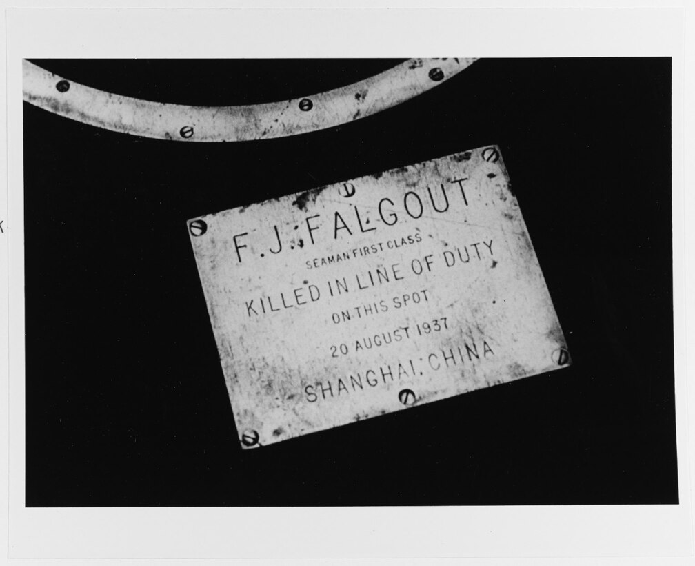 Plaque honoring the memory of Seaman First Class F.J. Falgout, USN, on the well-deck of USS Augusta (CA-31), marking the spot where he was killed by a stray Chinese or Japanese antiaircraft shell, 20 August 1937, at Shanghai, China (NH 83550).