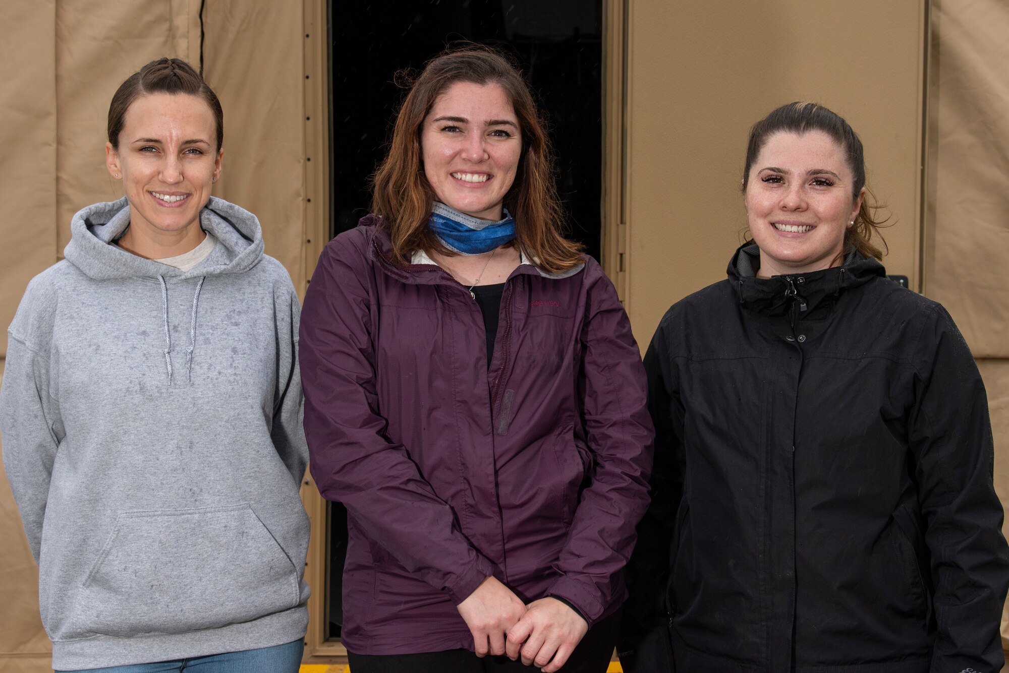 Augmentees pose in front of youth pod.