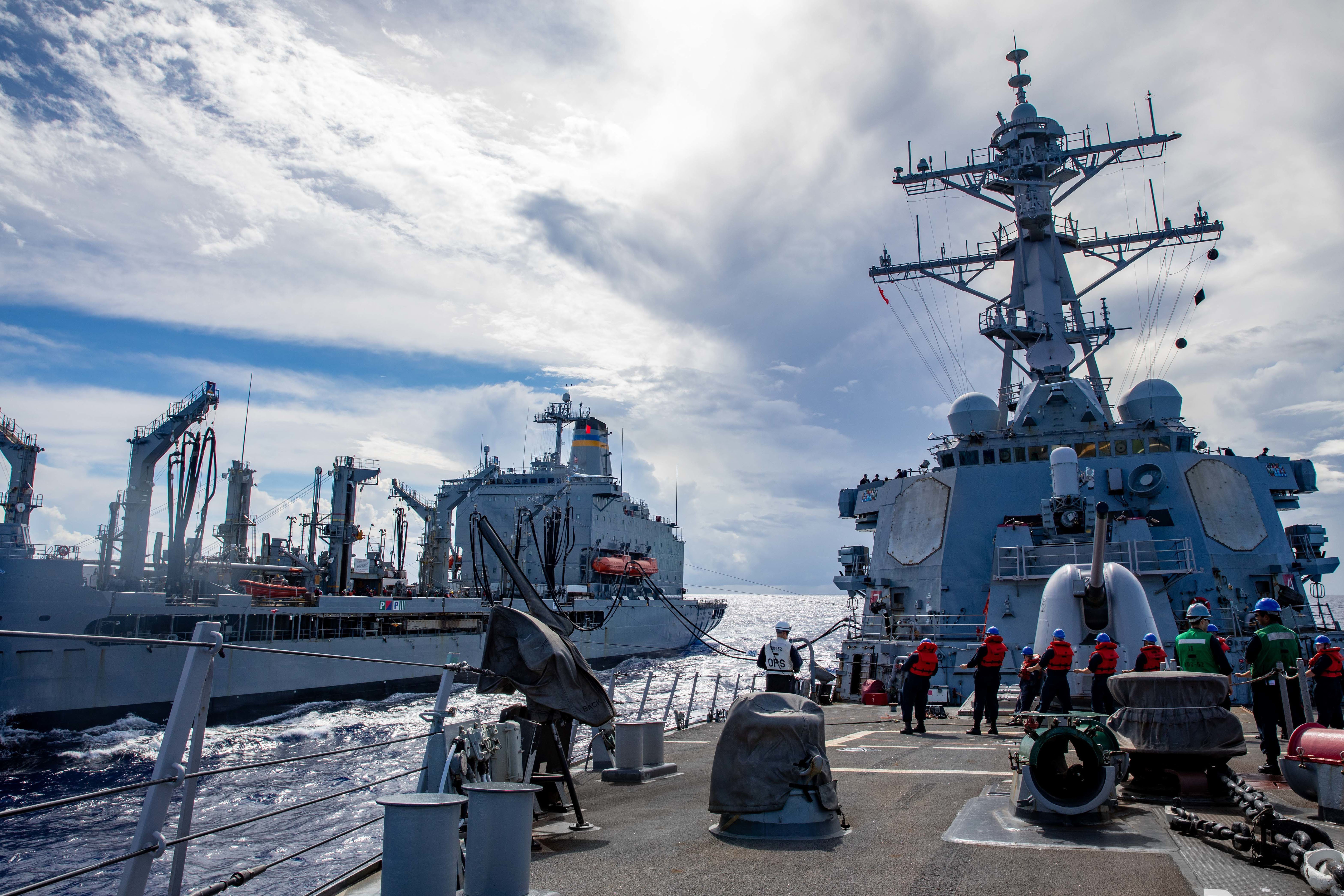 USS Barry (DDG 52) conducts a replenishment-at-sea with USNS Yukon (T-AO 202) during MALABAR 2021.
