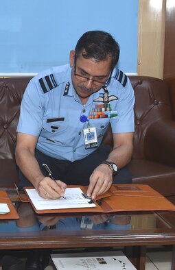 Indian Air Force Air Vice Marshal Narmdeshwar Tiwari, Assistant Chief of Air Staff for Plans, counter-signs a landmark agreement to co-develop air-launched Unmanned Aerial Vehicles under the U.S.-India Defense Technology and Trade Initiative, at Indian Air Force Headquarters in New Delhi, India, on July 30, 2021. (Courtesy photo)