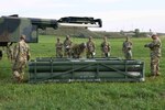 Members of the U.S. Army’s Bravo Battery, 4th Battalion, 4th Security Forces Assistance Brigade, evaluate operations of the High Mobility Artillery Rocket System while attending the Combined Duties Training Course hosted by the 2nd Battalion 196th Regiment (Regional Training Institute), South Dakota National Guard, Aug. 28, 2021, in Sioux Falls, S.D. The training prepared 4-4th SFAB for deployment to Europe.