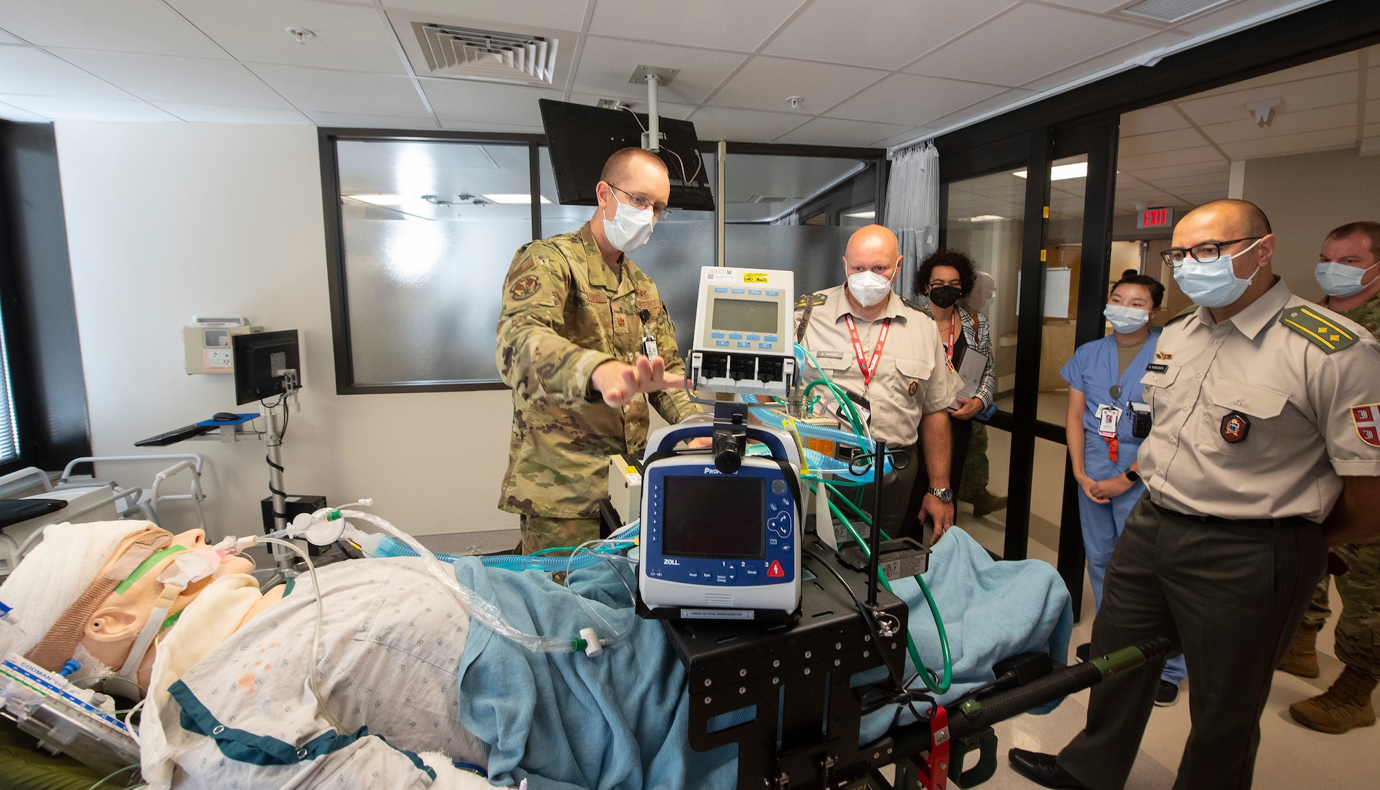 Maj. (Dr.) Andrew Bergland, 88th Medical Group, briefs Serbian Col. (Dr.) Danilo Jokovic (center) and Lt. Col. (Dr.) Vladan Zivkovic on the system Wright-Patterson Medical Center’s Intensive Care Unit uses to transport COVID-19 patients. The doctors leda Serbian delegation sponsored by the Ohio National Guard’s State Partnership Program.