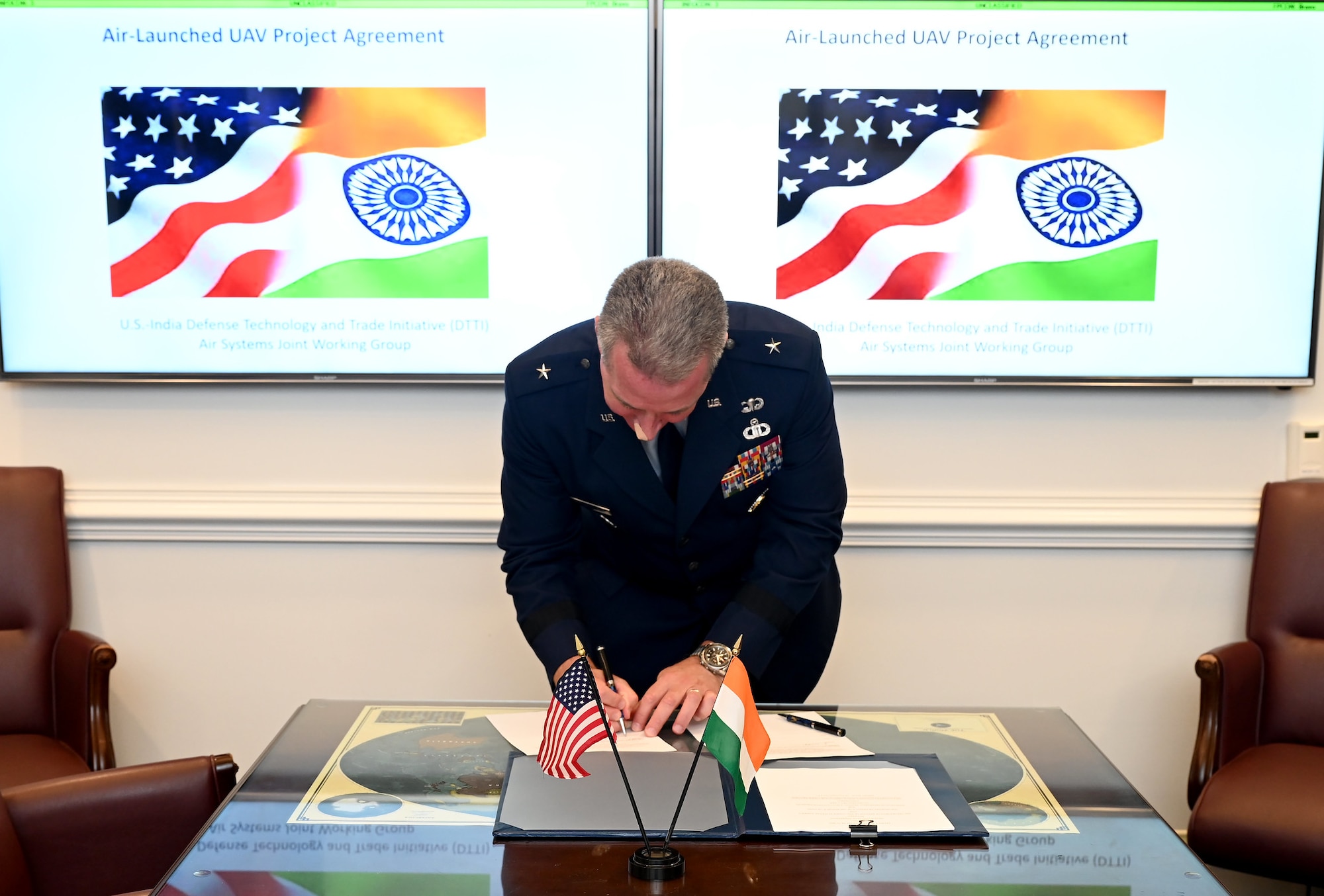 Cochair of the US-India Defense Technology and Trade Initiative, Brig. Gen. Brian Bruckbauer signs the Air Launched UAV Co-Development Agreement at the Pentagon, Arlington, Va., July 16, 2021. (U.S. Air Force photo by Andy Morataya)
