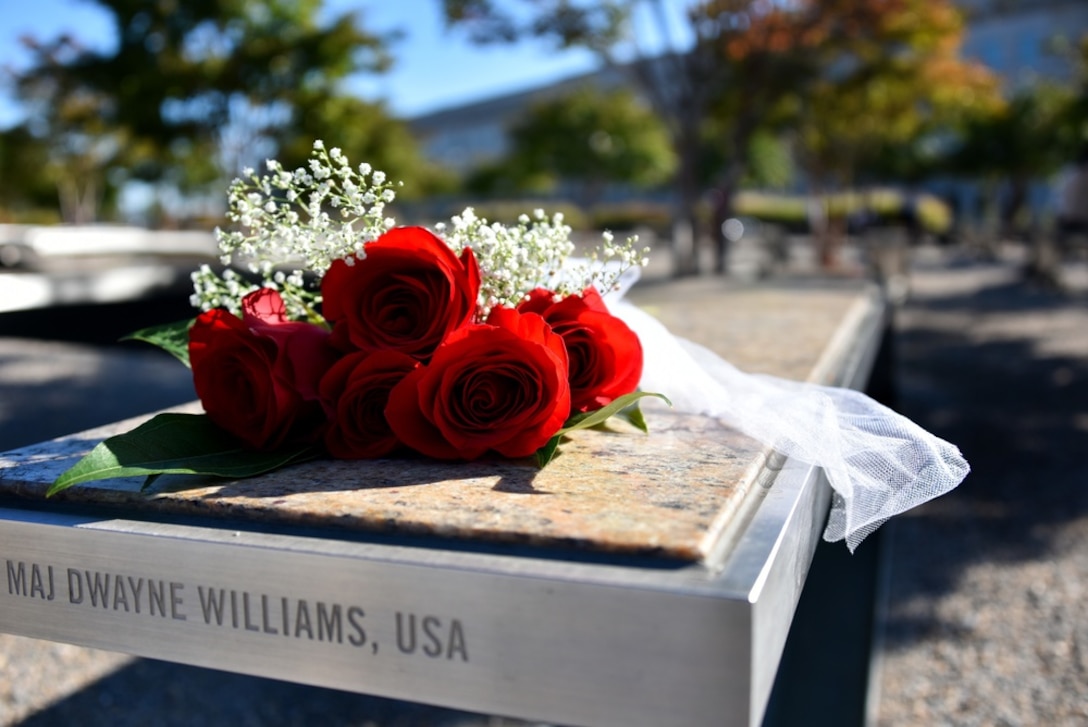 Roses rest on a memorial bench at the National 9/11 Pentagon Memorial.
