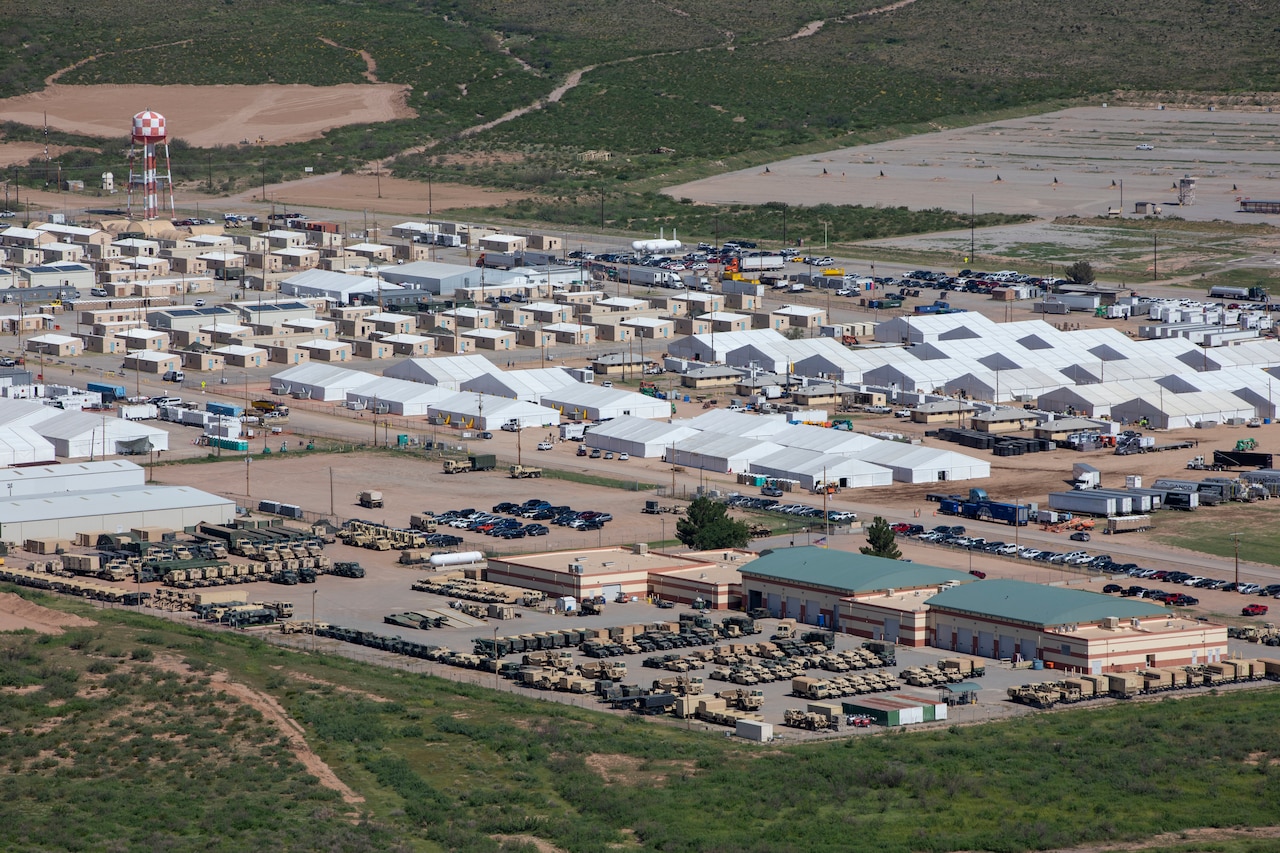 An aerial view of a small city built of temporary structures.