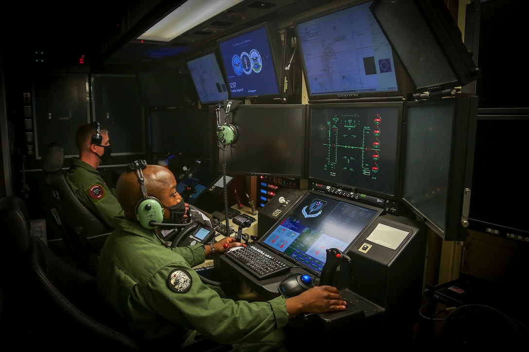 U.S. Marine Corps Captain Joshua Brooks, an unmanned aircraft system representative, and Master Sergeant Willie Cheeseboro Jr., an enlisted aircrew coordinator with Marine Unmanned Aerial Vehicle Squadron (VMU) 1, prepare to launch and operate the first Marine Corps owned MQ-9A Reaper on Marine Corps Air Station Yuma, Ariz. August 30, 2021. The MQ-9A is designed to maintain a persistent presence overseas with its long range endurance, and has the capability to provide immediate support to ground units. 

(U.S. Marine Corps Photo by Lance Cpl Gabrielle Sanders)