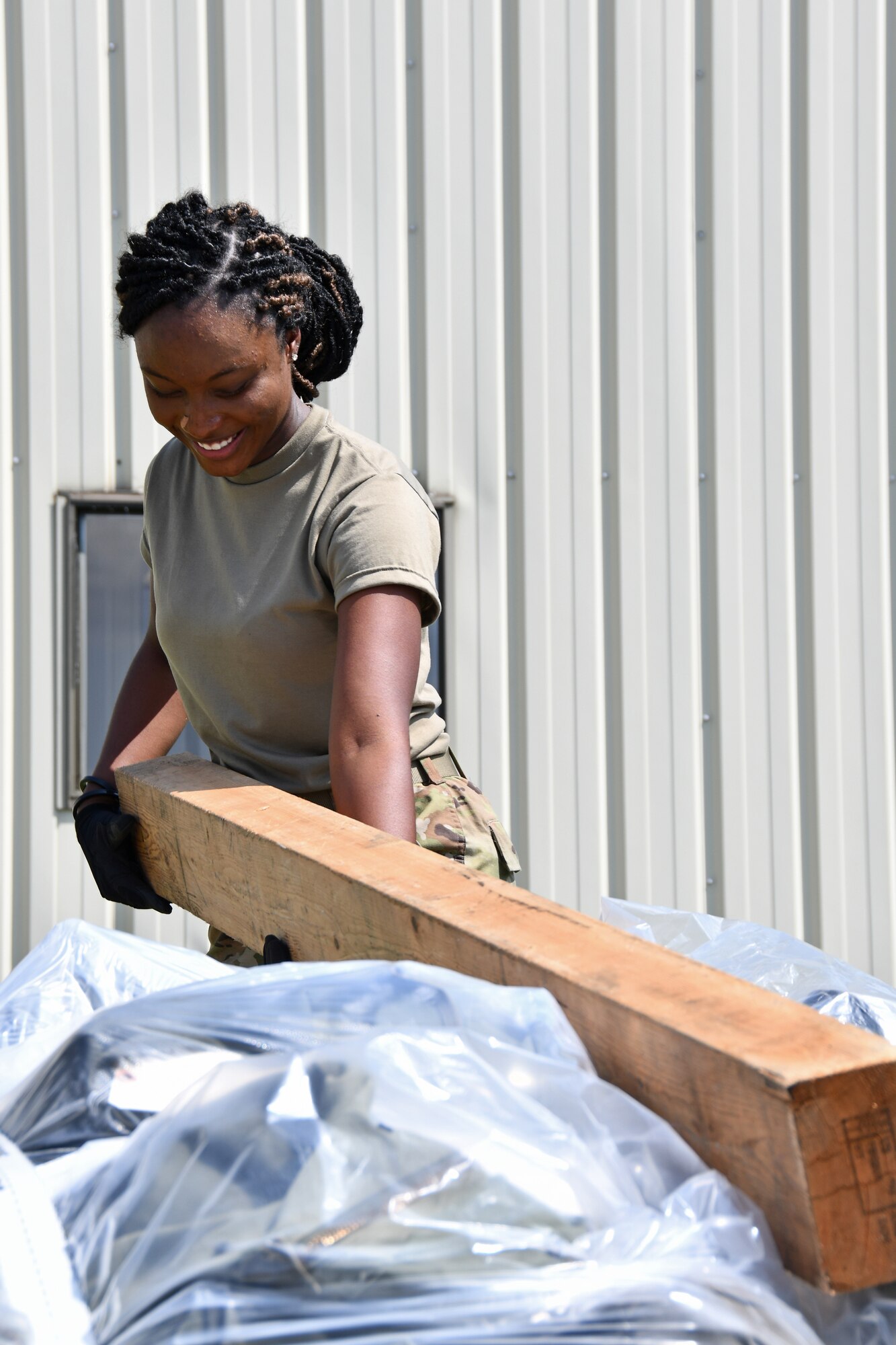 Airman 1st Class Jennifer Joseph, a materials handler with the 104th Logistics Readiness Squadron, secures a pallet during a mobility exercise August 13, 2021, at Barnes Air National Guard Base, Massachusetts. Mobility exercises test the wing's ability to rapidly deploy aircraft, equipment, personnel and cargo. (U.S. Air National Guard photo by Staff Sgt. Hanna Smith)