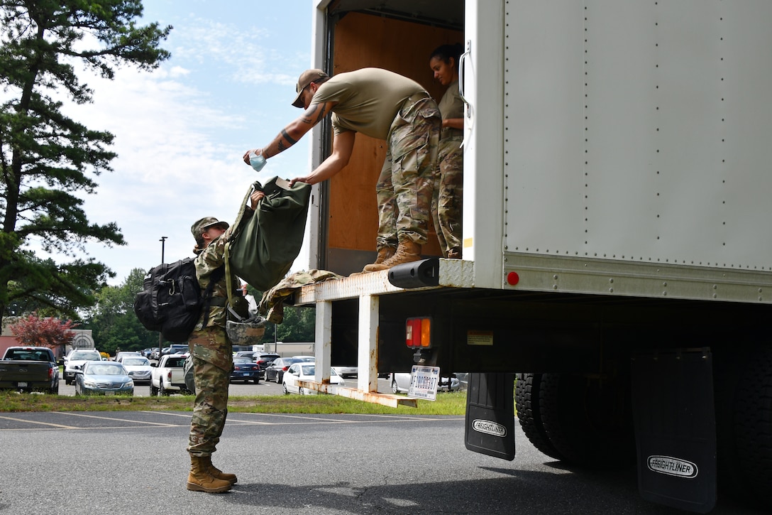 104th Fighter Wing Airmen perform a bag drop during a mobility exercise August 14, 2021, at Barnes Air National Guard Base, Massachusetts. Mobility exercises test the wing's ability to rapidly deploy aircraft, equipment, personnel and cargo. (U.S. Air National Guard photo by Staff Sgt. Hanna Smith)