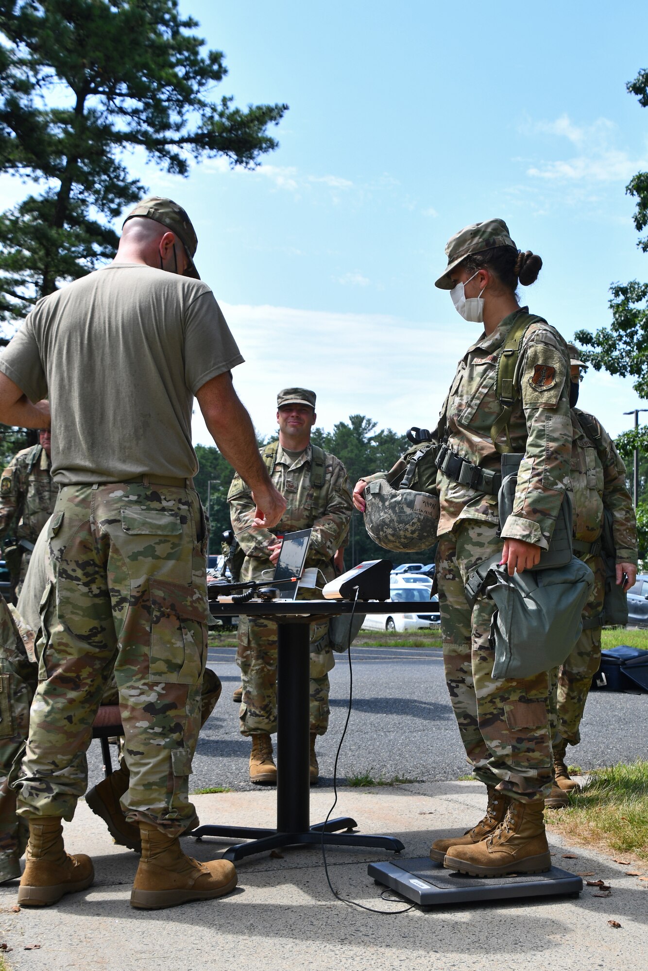 104th Fighter Wing Airmen get weighed prior to processing through a Pre-Deployment Function line during a mobility exercise August 14, 2021, at Barnes Air National Guard Base, Massachusetts. Mobility exercises test the wing's ability to rapidly deploy aircraft, equipment, personnel and cargo. (U.S. Air National Guard photo by Staff Sgt. Hanna Smith)