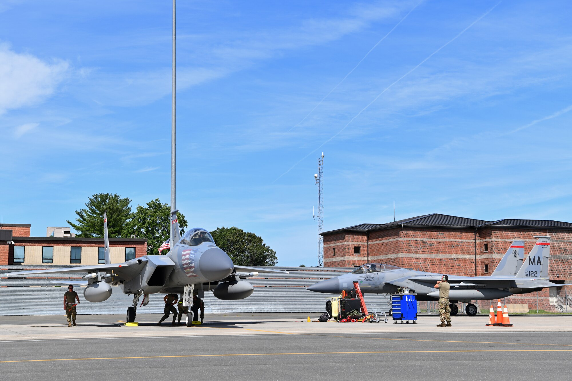 Crew chiefs with the 104th Fighter Wing's Aircraft Maintenance Squadron recieve and process F-15 Eagles during a mobility exercise August 15, 2021, at Barnes Air National Guard Base, Massachusetts. Mobility exercises test the wing's ability to rapidly deploy aircraft, equipment, personnel and cargo. (U.S. Air National Guard photo by Staff Sgt. Hanna Smith)
