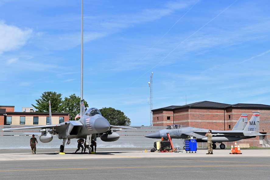 Crew chiefs with the 104th Fighter Wing's Aircraft Maintenance Squadron recieve and process F-15 Eagles during a mobility exercise August 15, 2021, at Barnes Air National Guard Base, Massachusetts. Mobility exercises test the wing's ability to rapidly deploy aircraft, equipment, personnel and cargo. (U.S. Air National Guard photo by Staff Sgt. Hanna Smith)