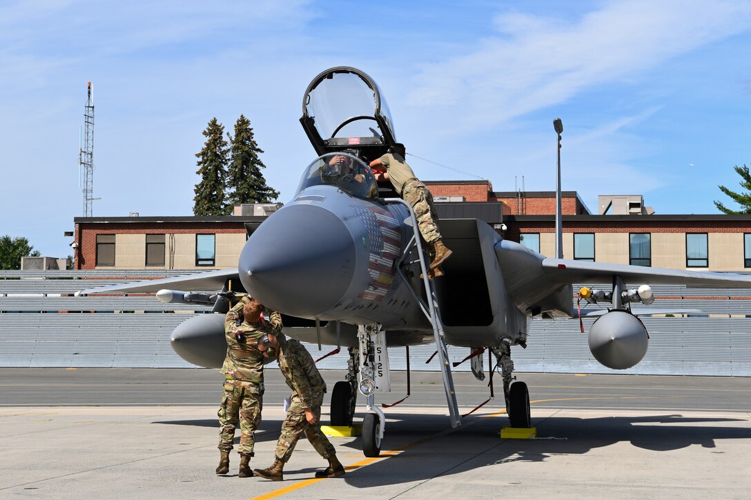 Crew chiefs with the 104th Fighter Wing's Aircraft Maintenance Squadron recieve and process F-15 Eagles during a mobility exercise August 15, 2021, at Barnes Air National Guard Base, Massachusetts. Mobility exercises test the wing's ability to rapidly deploy aircraft, equipment, personnel and cargo. (U.S. Air National Guard photo by Staff Sgt. Hanna Smith)