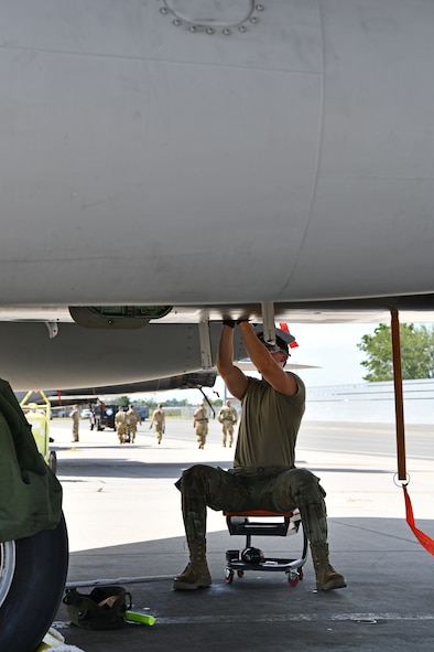 Airman 1st Class Brenden Gadry, a crew chief with the 104th Aircraft Maintenance Squadron, assesses a component of a F-15 Eagle aircraft during a mobility exercise August 15, 2021, at Barnes Air National Guard Base, Massachusetts. Mobility exercises test the wing's ability to rapidly deploy aircraft, equipment, personnel and cargo. (U.S. Air National Guard photo by Staff Sgt. Hanna Smith)