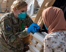 Guardian distributes eating utensils.