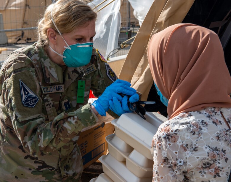 Guardian distributes eating utensils.