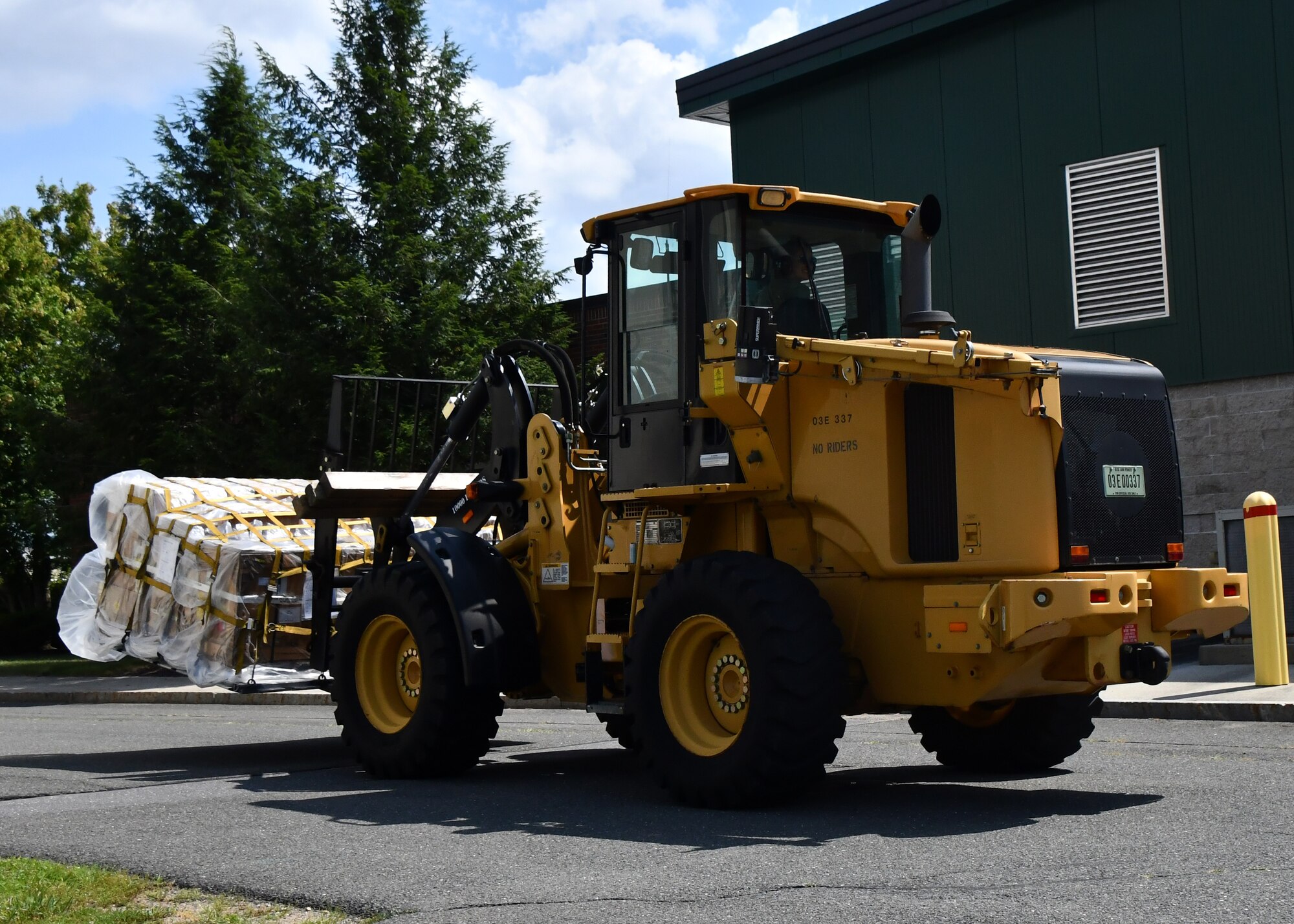 Tech. Sgt. Victoria Williamson, 104th Logistics Readiness Squadron maintenance supply liaison, moves a pallet during a mobility exercise August 13, 2021, at Barnes Air National Guard Base, Massachusetts. The exercise was in progress August 9-15 and served as a practice opportunity for members to evaluate capabilities of their squadrons in the event of a base-wide mobilization. (U.S. Air National Guard photo by Staff Sgt. Sara Kolinski)