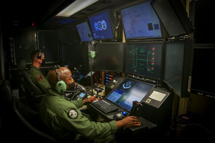 U.S. Marine Corps Captain Joshua Brooks, an unmanned aircraft system representative, and Master Sergeant Willie Cheeseboro Jr., an enlisted aircrew coordinator with Marine Unmanned Aerial Vehicle Squadron 1, prepare to launch and operate the first Marine Corps owned MQ-9A Reaper on Marine Corps Air Station Yuma, Ariz. Aug. 30, 2021. The MQ-9A is designed to maintain a persistent presence overseas with its long range endurance, and has the capability to provide immediate support to ground units.