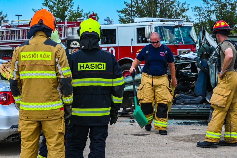 Firefighters from the Army of the Czech Republic perform car extrication tactics, Aug. 16, 2021, during a training exercise with the 155th Air Refueling Wing fire department at Lincoln Air Force Base, Neb. This Nebraska National Guard and Czech Republic armed forces training exchange is one of many facilitated by the National Guard’s State Partnership Program.