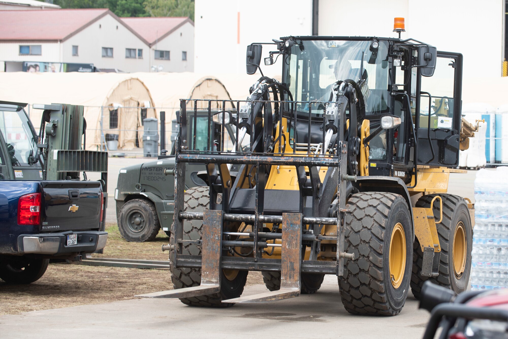 An Airman drives a forklift.