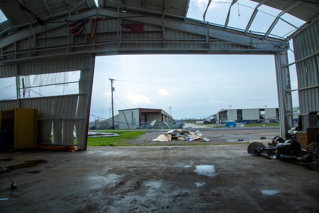 A tattered flag hangs in a hangar damaged by Hurricane Ida at the Houma-Terrebonne Airport near Houma, Louisiana, Sept. 1, 2021.