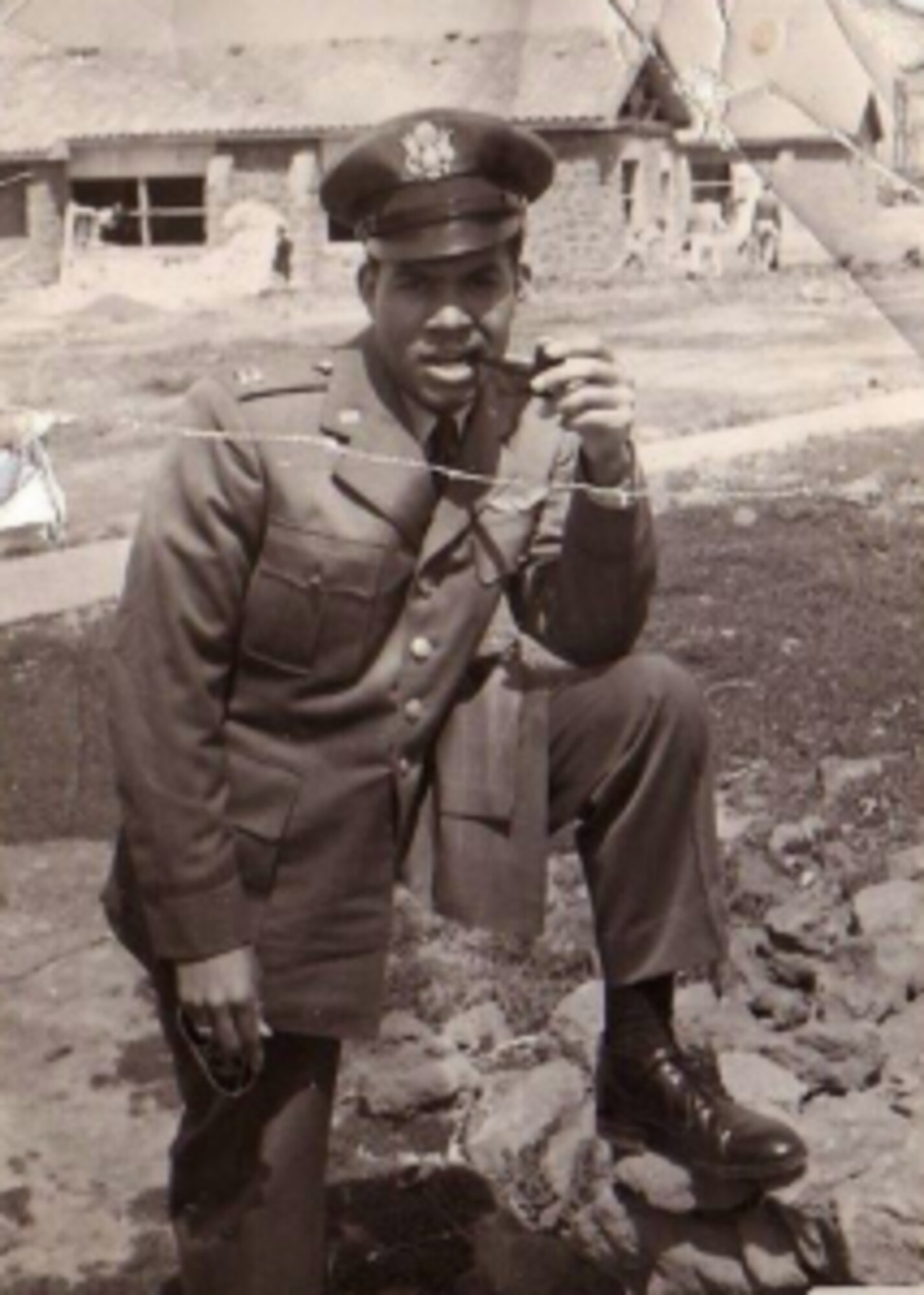 World War II pilot poses for photo