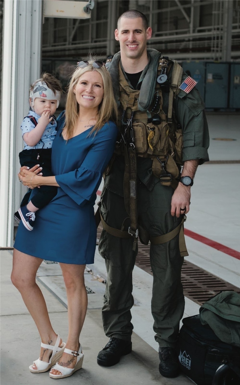 FILE PHOTO of Naval Air Crewman (Helicopter) 2nd Class James P. Buriak, 31, from Salem, Virginia, with wife and son. Buriak was one of five Sailors killed when an MH-60S Seahawk helicopter, assigned to Helicopter Sea Combat Squadron (HSC) 8, crashed approximately 60 nautical miles off the coast of San Diego, Aug. 31.