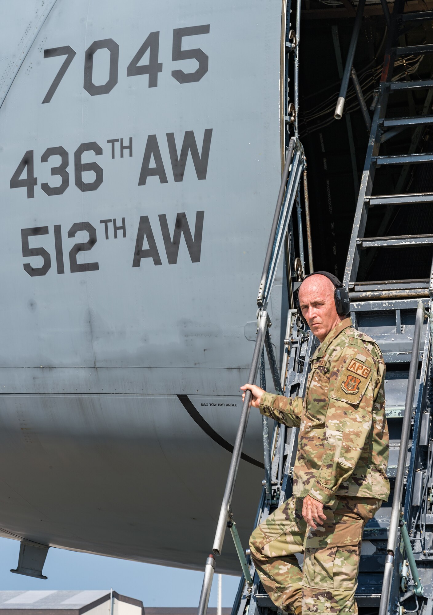 Chief Master Sgt. Bryan “Skip” Ford, 512th Aircraft Maintenance Squadron superintendent, poses for a photo on the crew entrance ladder of a C-5M Super Galaxy at Dover Air Force Base, Delaware, Aug. 25, 2021. Ford recently recalled the events of Sept. 11, 2001, while stationed at Dover AFB and how 9/11 changed how he viewed our relative security and freedom as a nation. (U.S. Air Force photo by Roland Balik)