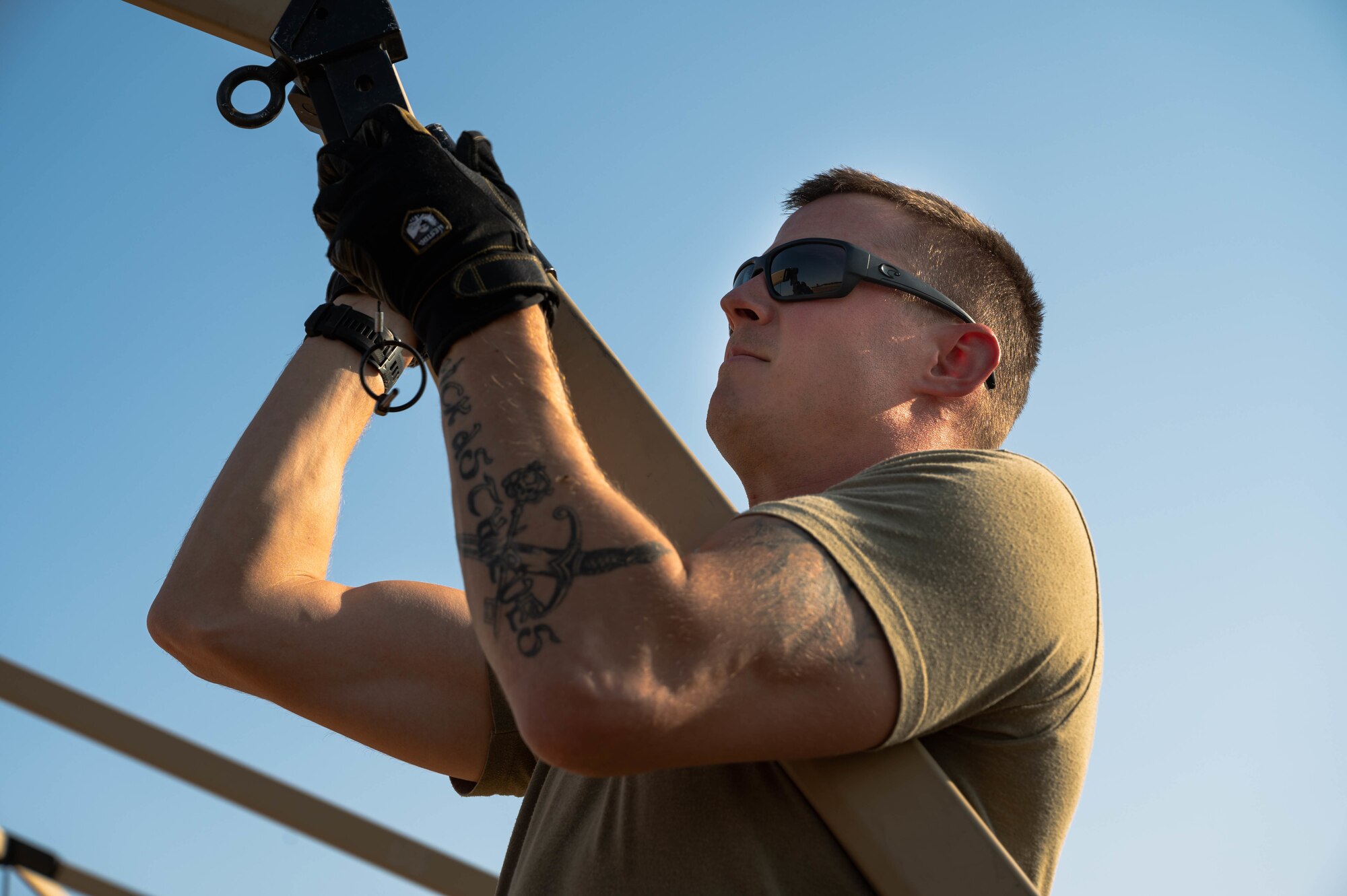 Airman sets-up tent.