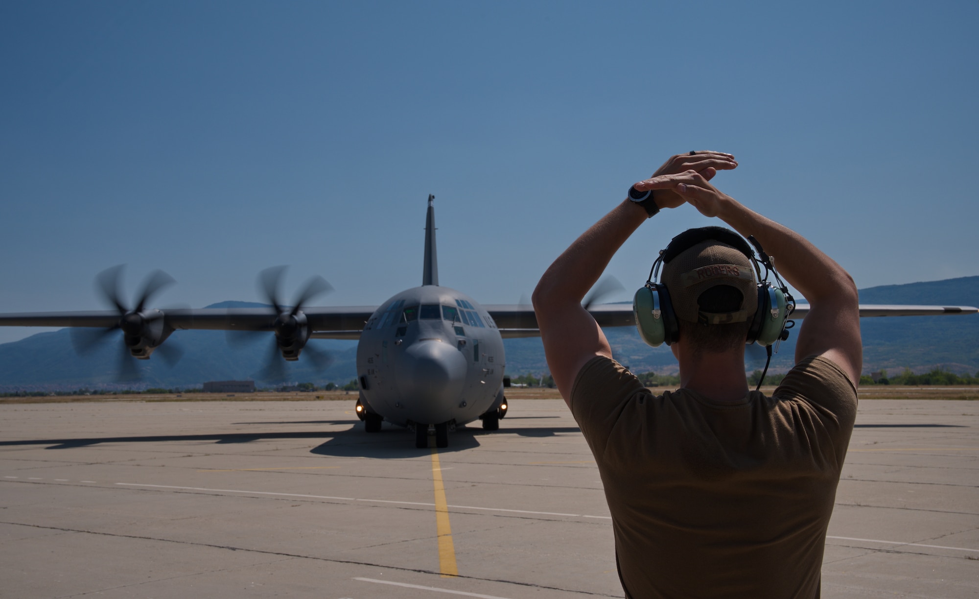 Airman directs aircraft.