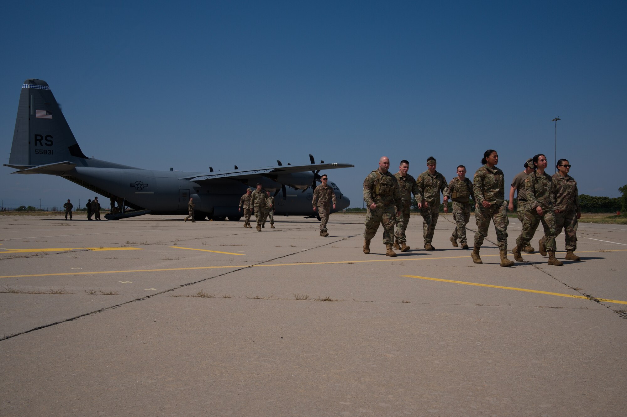 Airmen depart C-130.