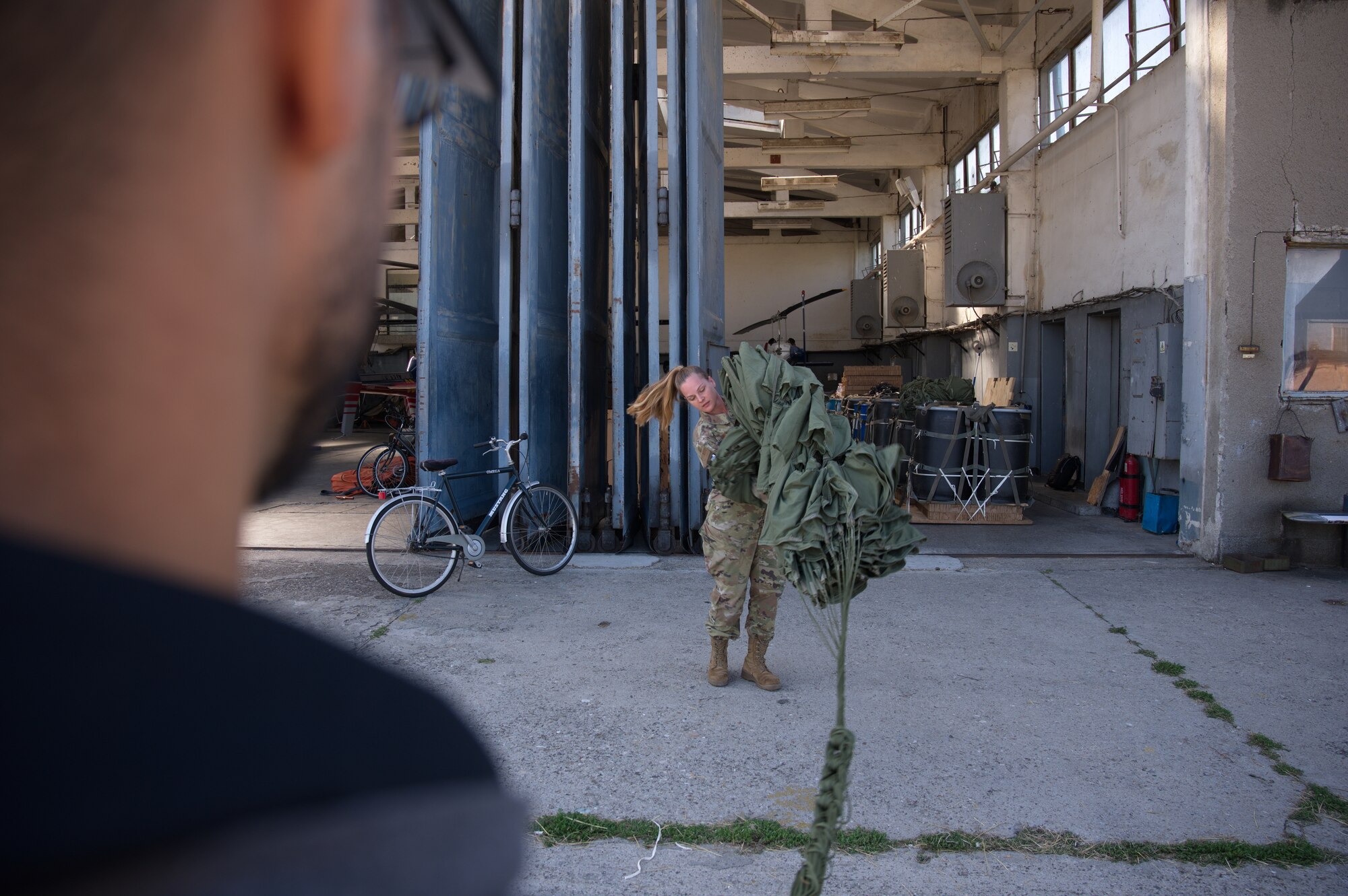 Airman prepares parachute.