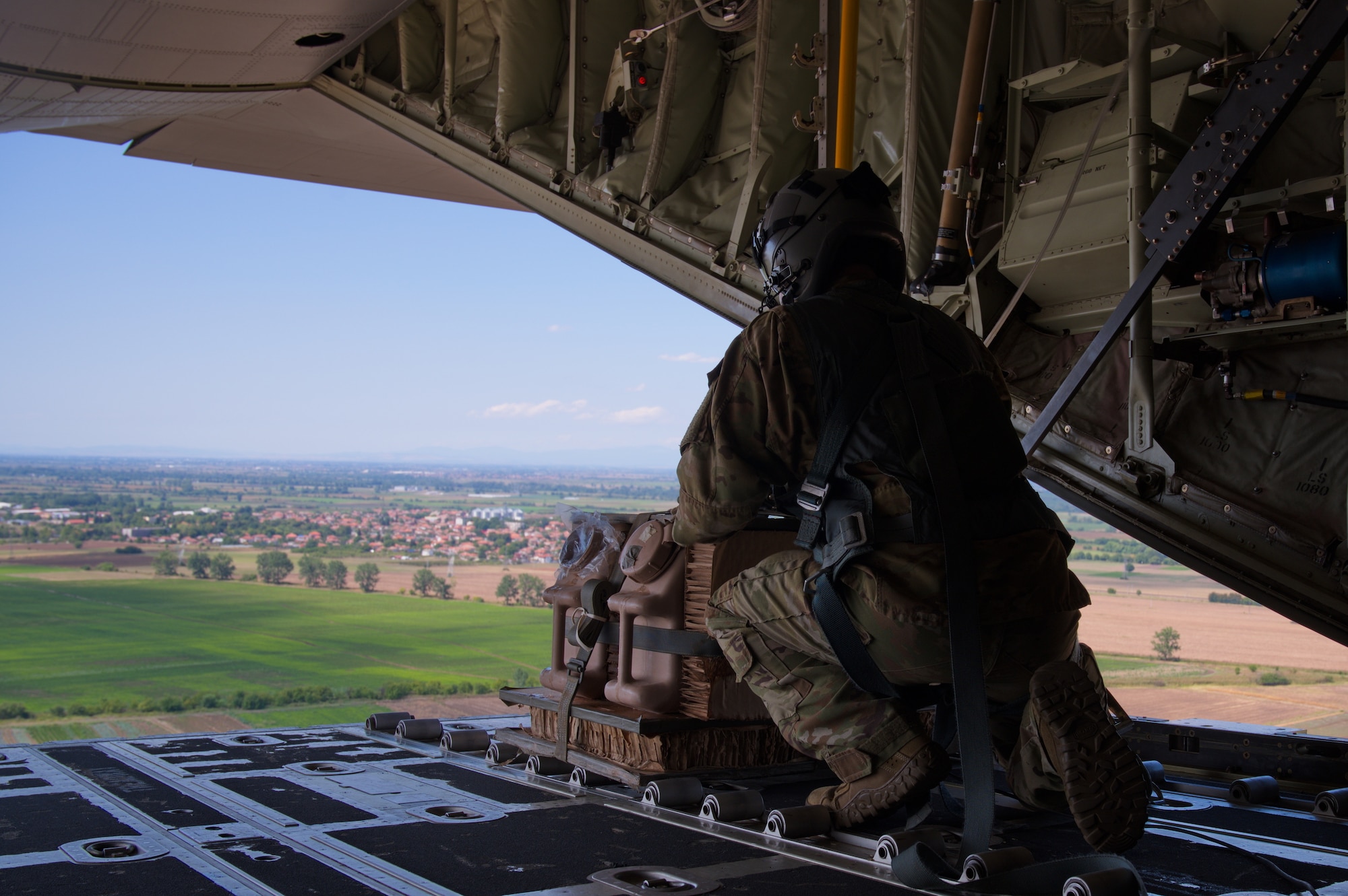 Loadmaster prepares to offload cargo.